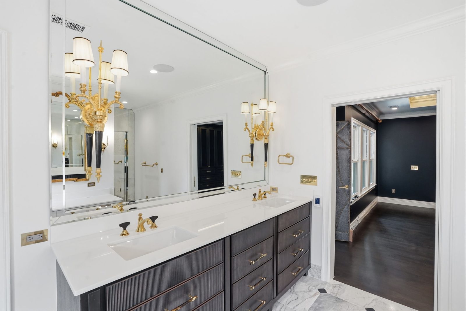 Bathroom remodel with double vanity and brass fixtures